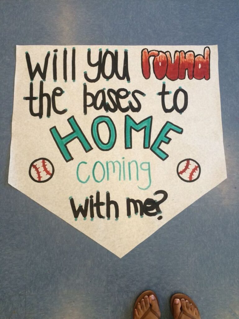 Home-plate shaped sign asking a date to homecoming with baseball puns and drawings.