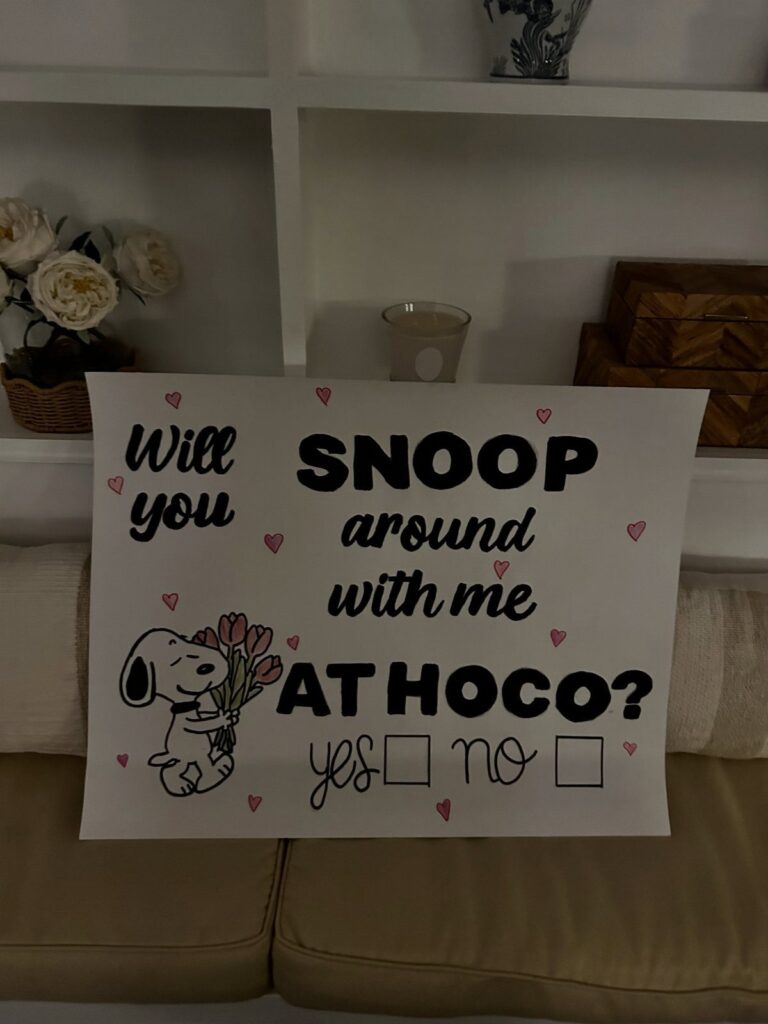 Homecoming proposal poster with Snoopy illustration and checkboxes for yes or no answers.